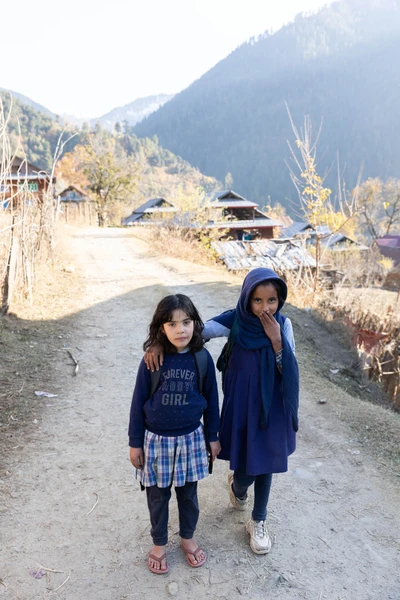 Aamina going back home with friend from school/Keran/LoC/Kupwara district/2023