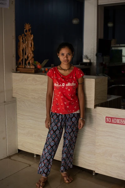 This girl works in the room cleaning service at a hotel in Sukma.



