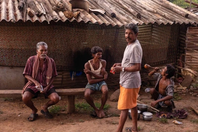 Men drinking after working time. Tabalagudi, Chitrakonda, Malkangiri/2023 