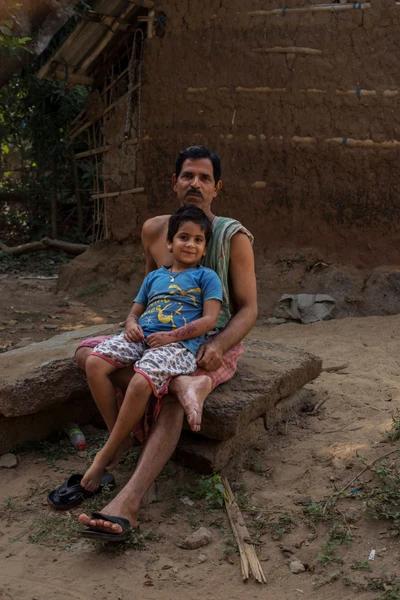 On the lap of Ramesh Chandra Misra is Vishnu priya who resides in Narvadi area, which is a brahmin village, in Satpada in Puri district.