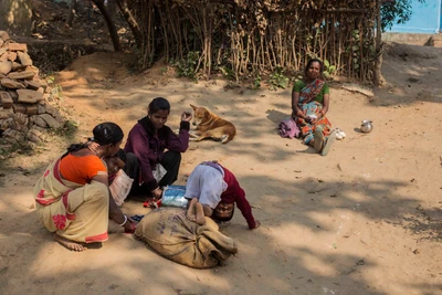 Jaraikela, a village in Orissa, shares border with some area of Jharkand, where presence of Maoists is conspicuous. This is a family of Kondh tribe. In this photograph, Saraswathi was coming from ration shop. Poonam is her daughter, and on the sack, her son. Sister in law and mother in law are also present.

