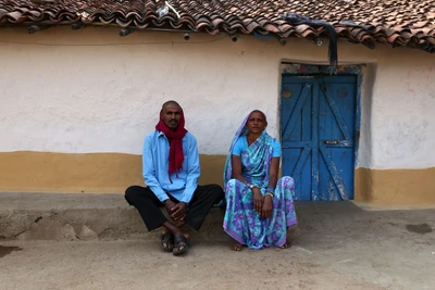 Husband and wife recently shaved their heads, part of a ritual. Take from Jhelum village, near Raipur 