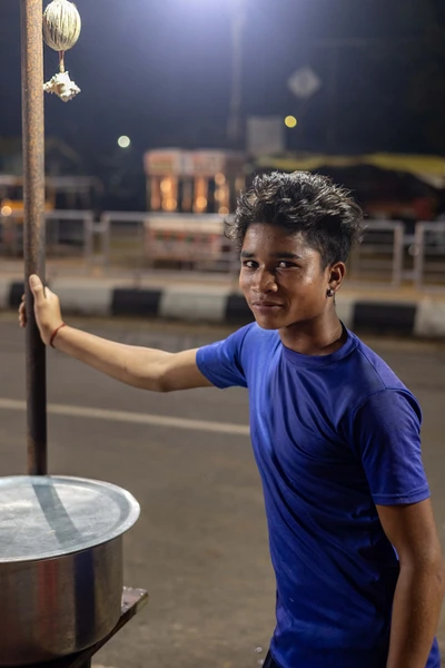 a boy from  bonda tribe, working at a street food shop in Malkangiri/2023