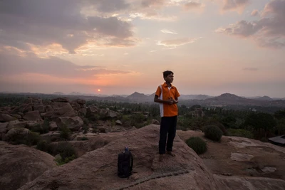 Putraj studies in 8th level. He sells tea in the premises of Virupaksha temple, Hampi.