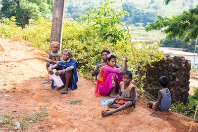 People of Bonda tribe, one of the oldest and most primitive in Indian mainland, waits on the roadside for a person from the government authority who had offered guidance for applying for an Adhar card.  Taken from Bondagati, Malkangiri/ 2023