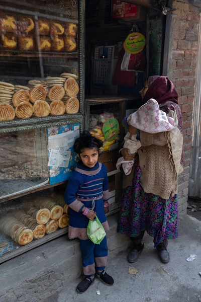 A family going back home after meeting a doctor in Babagail village, Limber wildlife sanctuary, LoC, Baramulla district/2023