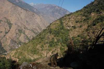 An old man coming back home from the nearest town which is three hills away. Take from Tatopani, Nepal