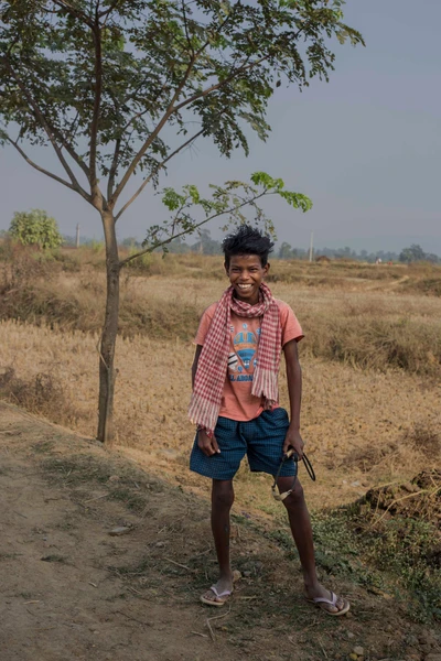 Illias Sama is a master in catapult among his gang. He has an ability for sharp pointing by catapult. He goes for a hunting for birds in paddy field in an evening. Taken from Surda village, Rourkela district.